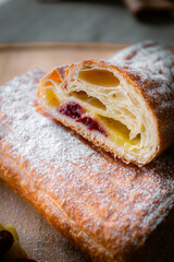 Bakery shop products - various kinds of baguette, bagel, donut, croissant, rolls, bread, puff pastry, powdered sugar delicious pies. Neutral background. Food from bakeries.