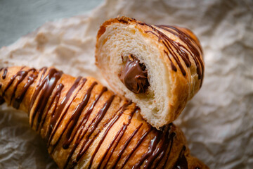 Bakery shop products - various kinds of baguette, bagel, donut, croissant, rolls, bread, puff pastry, powdered sugar delicious pies. Neutral background. Food from bakeries.