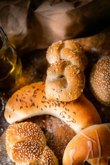 Bakery shop products - various kinds of baguette, bagel, donut, croissant, rolls, bread, puff pastry, powdered sugar delicious pies. Neutral background. Food from bakeries.