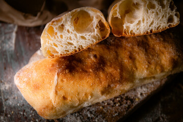 Bakery shop products - various kinds of baguette, bagel, donut, croissant, rolls, bread, puff pastry, powdered sugar delicious pies. Neutral background. Food from bakeries.