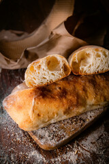 Bakery shop products - various kinds of baguette, bagel, donut, croissant, rolls, bread, puff pastry, powdered sugar delicious pies. Neutral background. Food from bakeries.