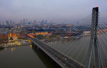 Fototapeta na wymiar Aerial view of Warsaw with Swietokrzyski Bridge over Vistula at twilight, Poland..