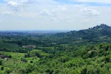 Fototapeta na wymiar Pyramids of Montevecchia and the Curone Valley Natural Park. Area of ​​northern Italy called Brianza. Woods of the Lombardy and Lecchese regions. Green hills full of vegetation.