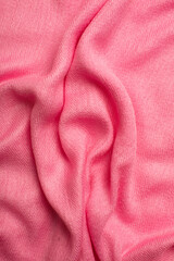 Pink soft fabric shaped as female genital organs, vulva and labia, vagina concept