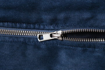 Plastic zipper background. Dark coat zipper. Empty copy space fabric texture. Closeup zipper teeth....