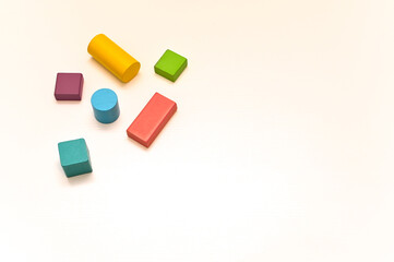 Multicolored wooden figures of different shapes. concept. empty space,