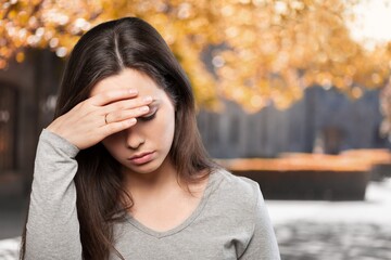 Stressed young woman in summer day