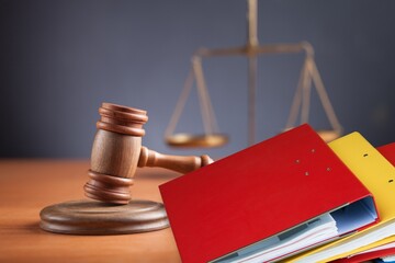 Wooden hammer, files on the judge table