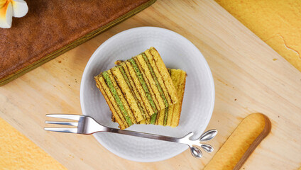 Lapis Legit is one of Indonesia’s delicious cake againts yellow background