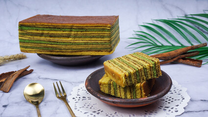 Sliced Indonesian Thousand Layer Cake or lapis legit, it served on clay plate