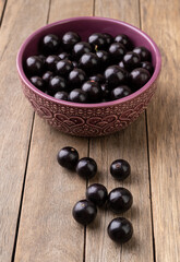 Jabuticabas on a bowl over wooden table