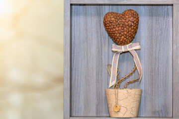 Symbolic heart made of coffee beans. Background with selective focus and copy space