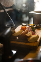 Smoked salmon on a wooden board with toasts and salad. Haute cuisine. fine dining cuisine.