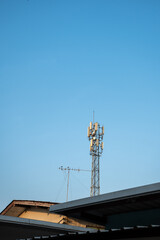 high radio tower againt blue sky