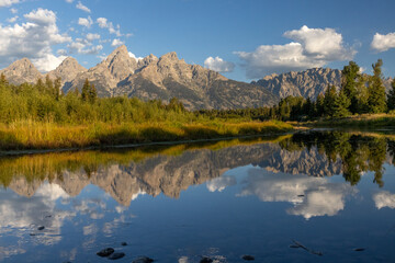 Fototapeta premium Grand Teton Mountains Reflected in Calm Water Mirror