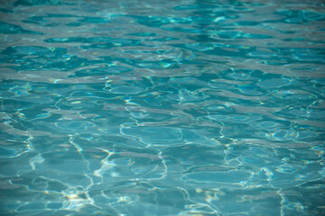 Tansparent clear calm water surface texture. Abstract nature background. Sea water pattern.