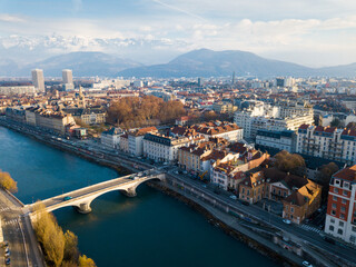 Fototapeta premium Panoramic aerial view of Grenoble city with bridge over Isere river, France