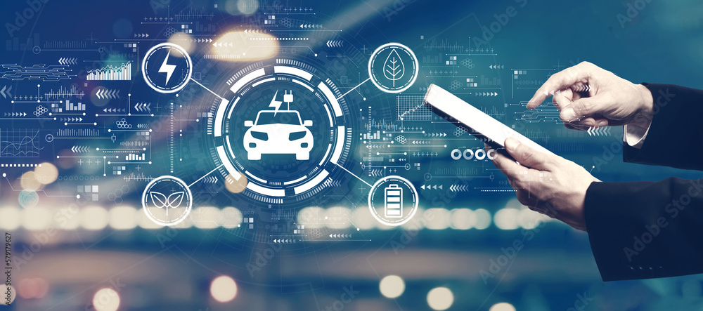 Aufkleber ev concept with businessman using a tablet computer