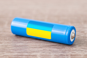 Flag of Ukraine on li-ion battery. Production of batteries in Ukraine concept