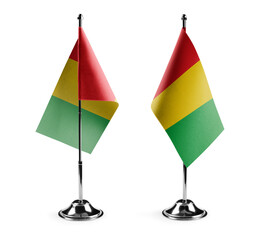 Small national flags of the Guinea on a white background