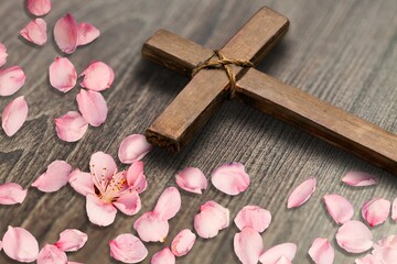 Easter wooden cross with fresh flowers