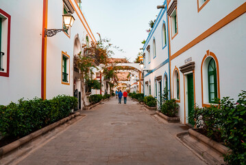 Fototapeta na wymiar Puerto de Morgan alley with white residential buildings on both side at Gran Canaria, Spain