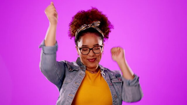 Happy, free and a woman enjoying a dance isolated on a pink background in a studio. Smile, goofy and a dancing girl moving to a beat, rhythm or audio with happiness, fun and freedom on a backdrop