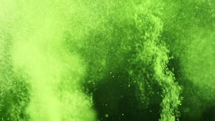 Turbulent green liquid fizzing and bubbling. Chemical reaction or scary Halloween witches' brew.