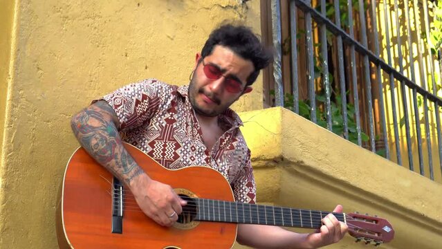 Man playing guitar in the street