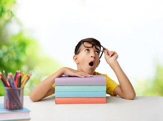 Cute kid study with books at home