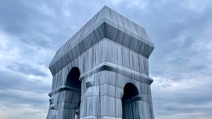 The Arc de Triomphe in Paris, France cloaked in fabric
