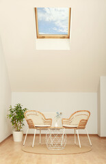 Attic room with stylish wooden furniture. Interior design