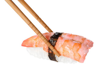 Chopsticks with delicious nigiri sushi isolated on white