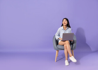 image of girl sitting on sofa  isolated on purple background