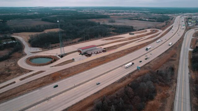 Dryvans, Flatbeds, Reefers truck drivers bypassing a Weigh Station next to Interstate. Department of Trasportation place where they pull bad drivers for safety inspection. Wisconsin, USA 4k
