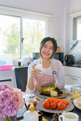 Thai girl Beginner cook, learn to cook, newlywed wife make salads and sandwiches along with watching video tutorials on the Internet