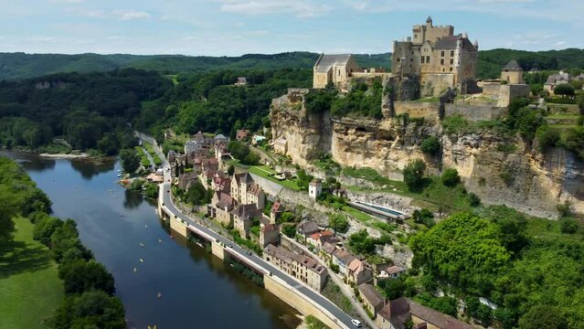 Smooth 4K aerial footage of Beynac-et-Cazenac, a beautiful hillside village located in the Dordogne department in southwestern France