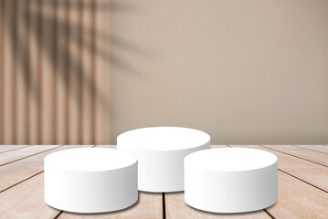 Empty old wooden table in front of abstract blurred wood wall and shadow of palm tree background with a clean white pedestal sits on a wooden table..