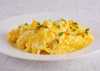 Scrambled Eggs with Seasonings on White Plate for Breakfast