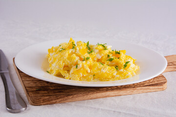 Scrambled Eggs with Seasonings on White Plate for Breakfast or Lunch