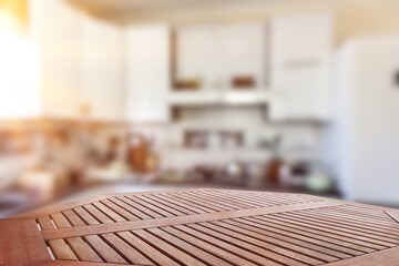 Wooden empty desk on kitchen interior.