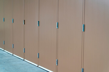 Row of lockers in industrial area of city or town for manufacturing and construction operations in neighborhood