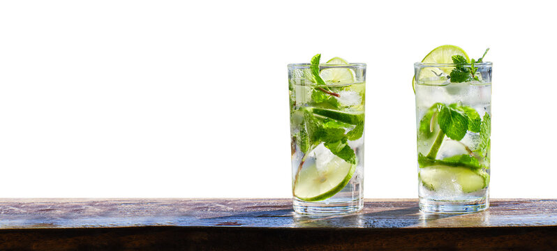 two mojito cocktails on wooden bar copy space composition with isolated background