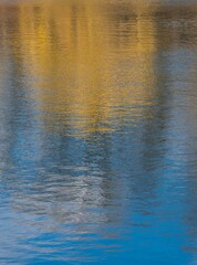 abstract yellow and blue reflection in water