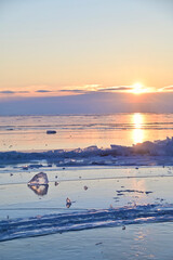 Sunrise Reflecting On Transparent Ice Surface of Lake Baikal in Winter
