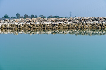 different sized stones lying in the river bank