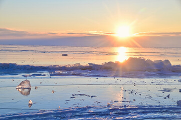 Sunrise Reflection with Transparent Ice Surface of Lake Baikal