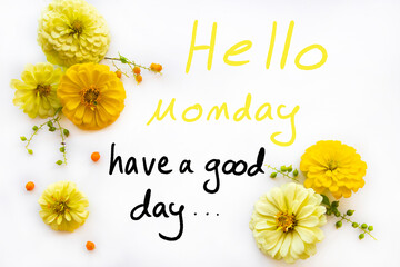 hello monday have a nice day message card handwriting with yellow flowers zinnia elegans arrangement hearts flat lay postcard style on background white  © phenphayom