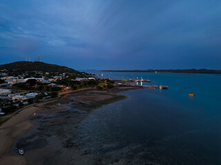 Aerial sunset showing the beach and town of Torres Strait islands