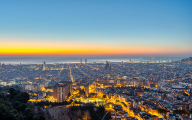 The skyline of Barcelona with the Mediterranean Sea before sunrise